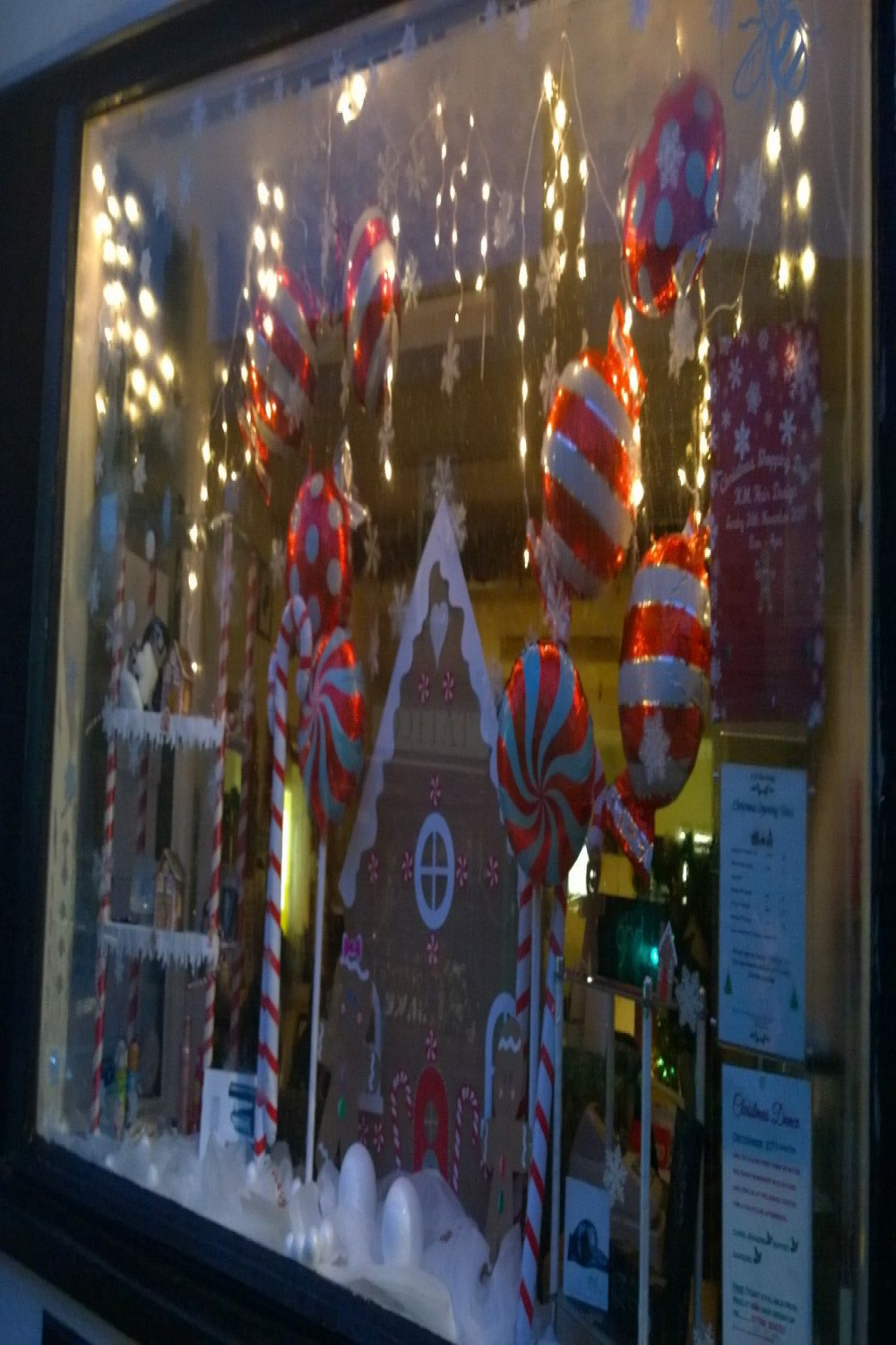 Gingerbread house and Gingerbread people window display with giant