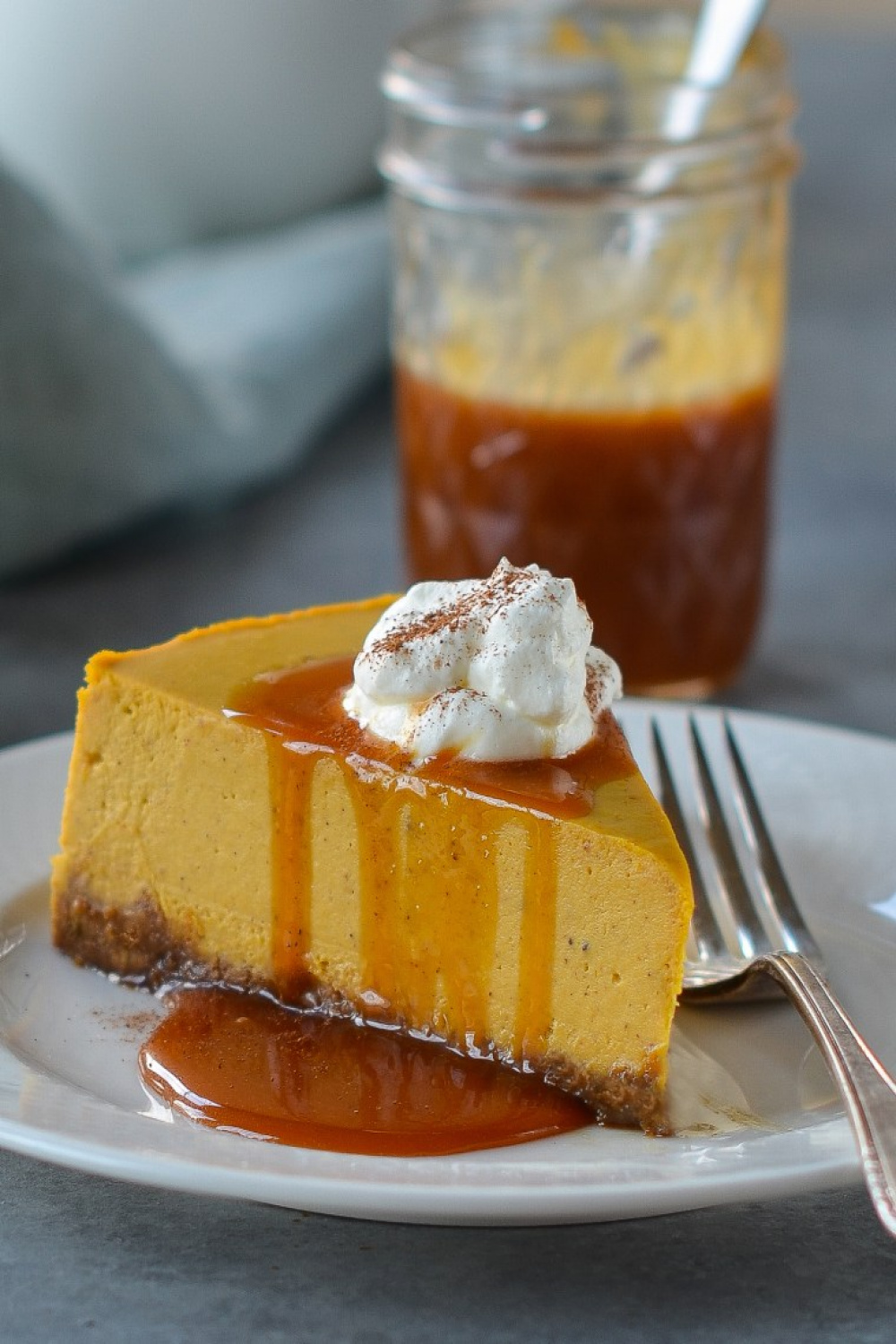 Pumpkin Cheesecake with Gingersnap Crust and Caramel Sauce