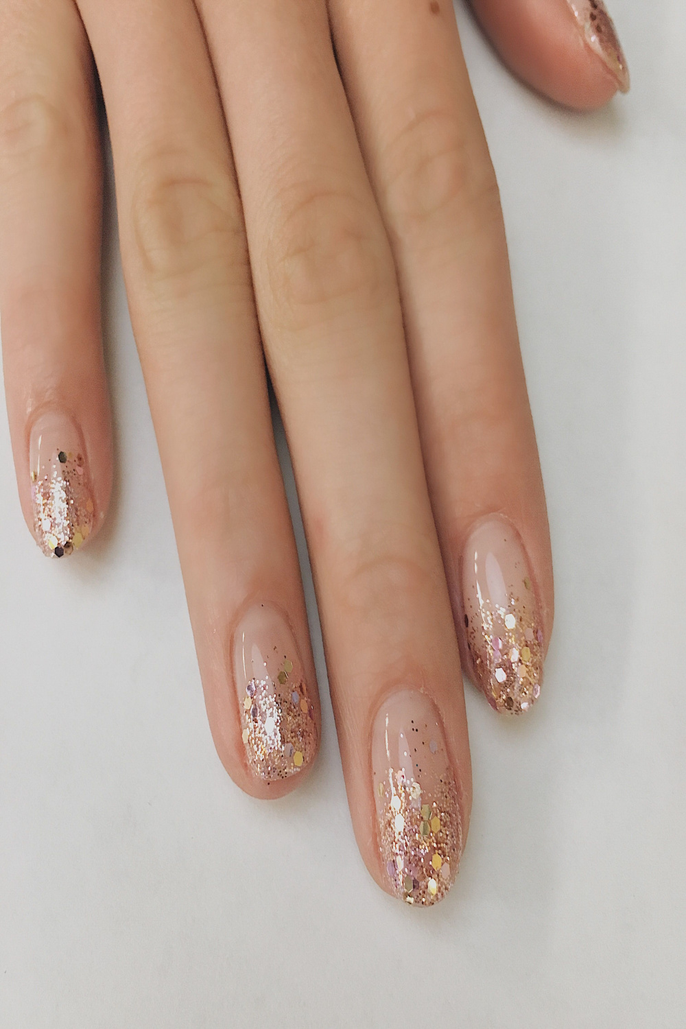 Looking for nail art ideas? Try a rose gold glitter ombre! Holiday