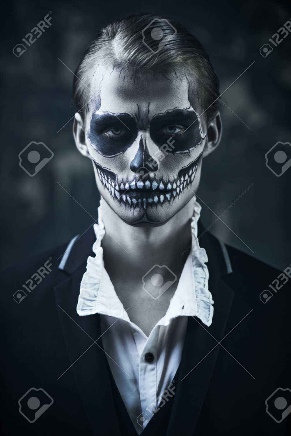 Portrait Of A Devilishly Attractive Man With Skull Makeup Wearing